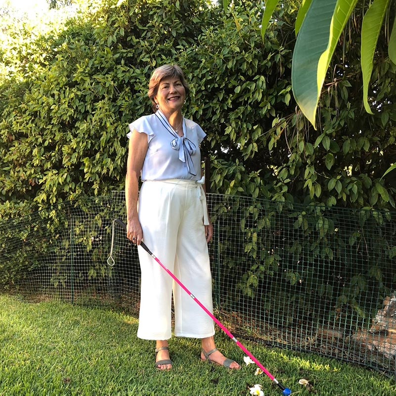 Piture of Colleen in the garden in front of a hedge. Piture of Colleen in the garden in front of a hedge.